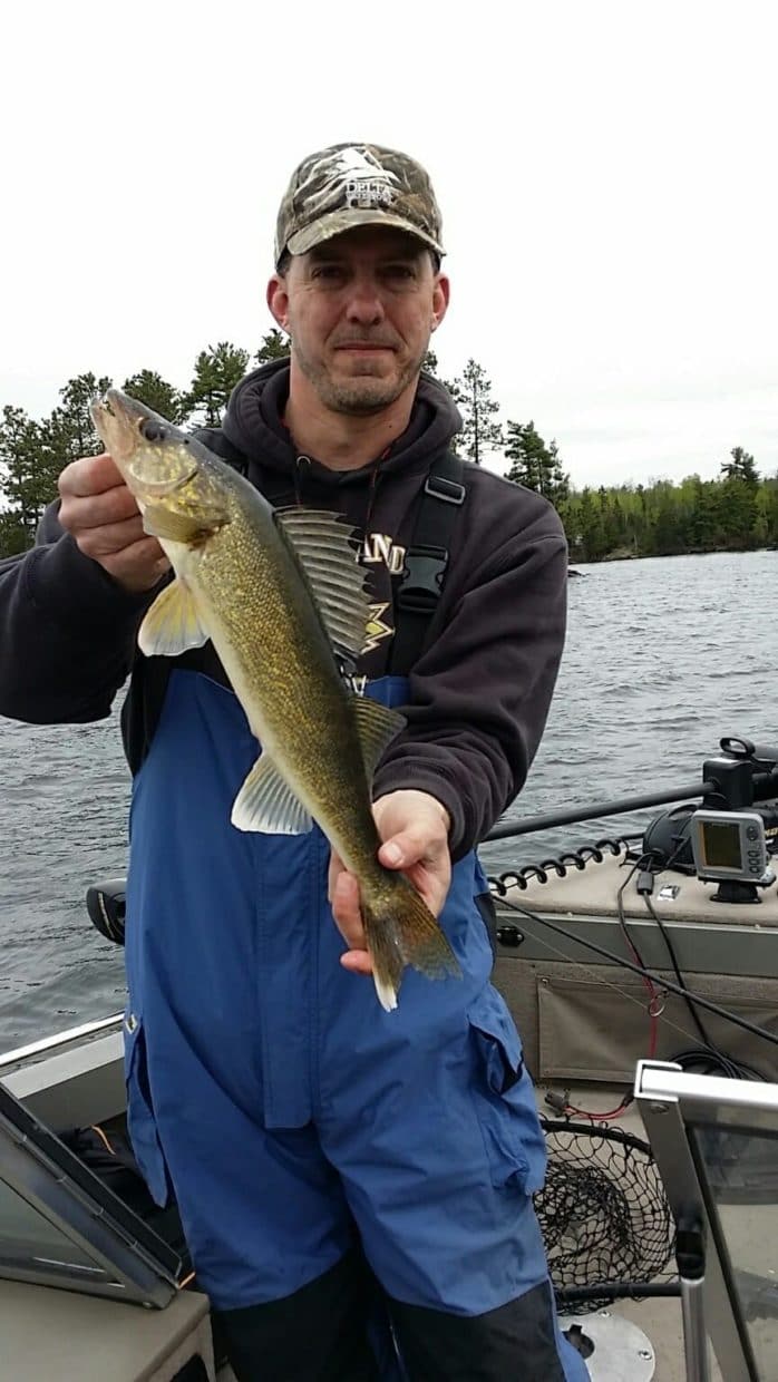 man holding walleye on Lake Vermilion