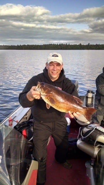 Man holding lake vermilion bass