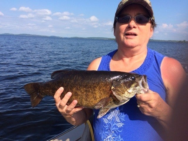 lady holding smallmouth bass on Lake Vermilion