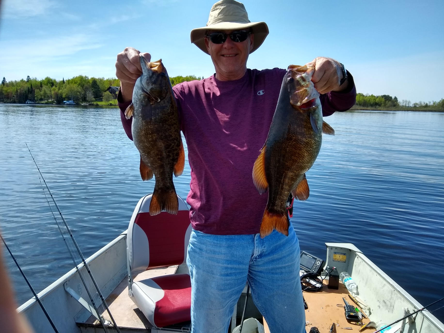 Man with 2 smallmouth bass