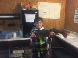 Boy holding walleye