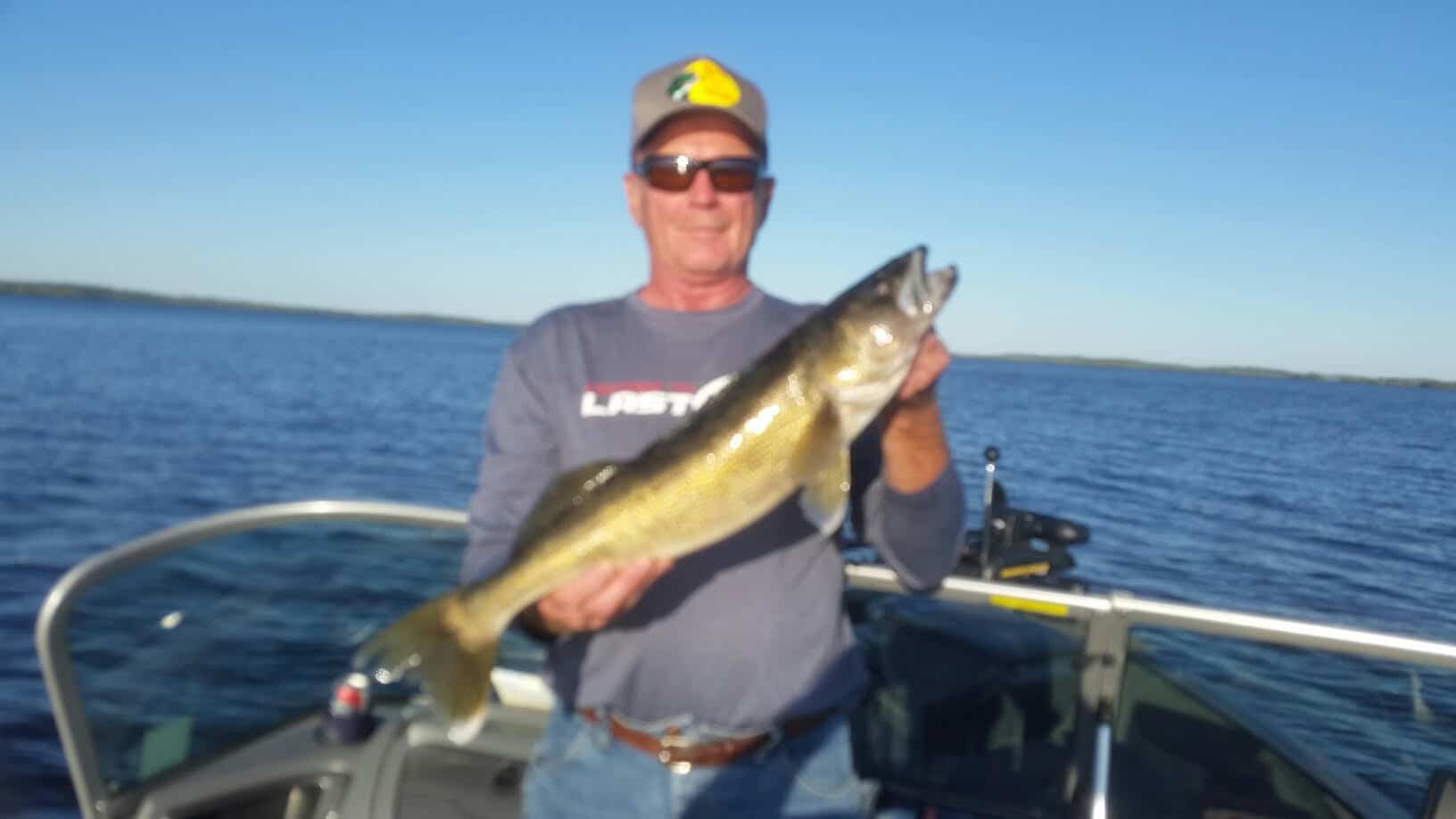 Man holding 25 inch walleye