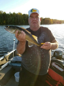 Man holding 21 inch walleye